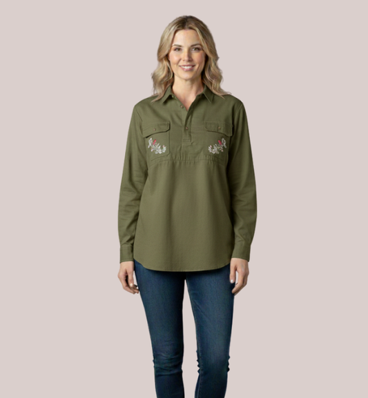 Model wearing an army green long-sleeve customizable maternity and nursing shirt with a concealed quarter-button placket and two custom floral-pattern embroidered chest patches.