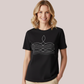 Woman wearing a black short-sleeve customizable maternity and nursing t-shirt with a discreet front zipper for breastfeeding access and white custom embroidered stitching detail.