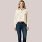 Model wearing a cream-beige long-sleeve customizable nursing shirt for women, featuring a quarter-button placket and twin custom floral embroidery patches on the front.