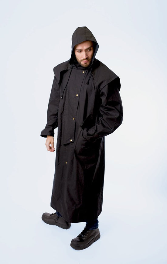 man wearing long coat with hoodie